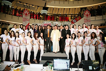 Hopeful contestants line up with organizing committee members and sponsors at Central World in Bangkok for the announcement of the 2011 Miss Tiffany’s Universe 2011 beauty pageant.